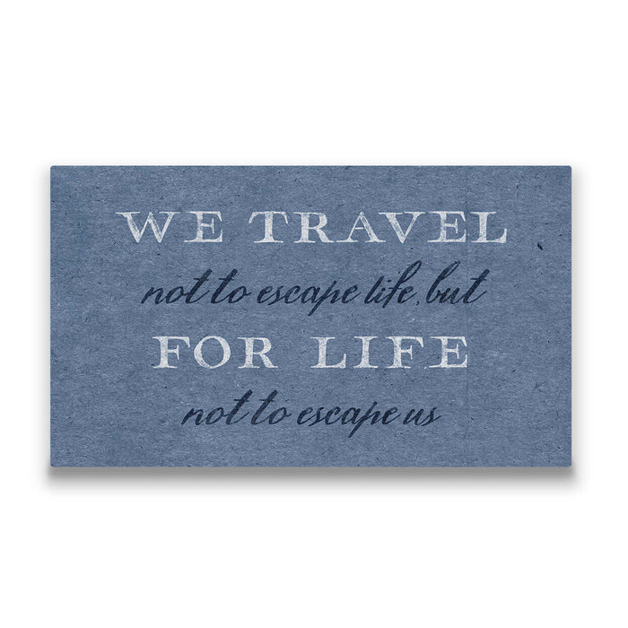 a travel canvas that says, “We travel not to escape life, but for life not to escape us”